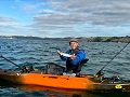 Catching a fish from the Vibe Sea Ghost 110 Fishing Kayak